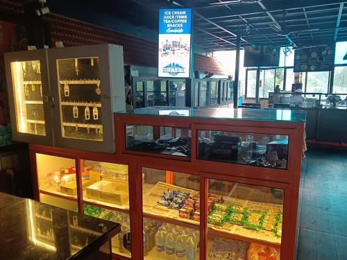a display case in a store with food inside at Hill View Homes,AC Suites in trivandrum in Trivandrum