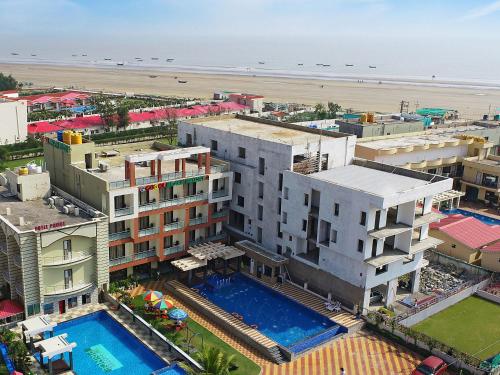 an aerial view of a resort with a pool and the beach at Gogol Beach Resort !! Beach 1 Minute !! in Mandarmoni