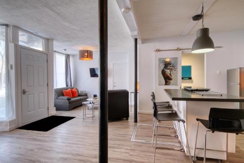 Χώρος καθιστικού στο Loft de l'Antiquaire by Hébergements DCL