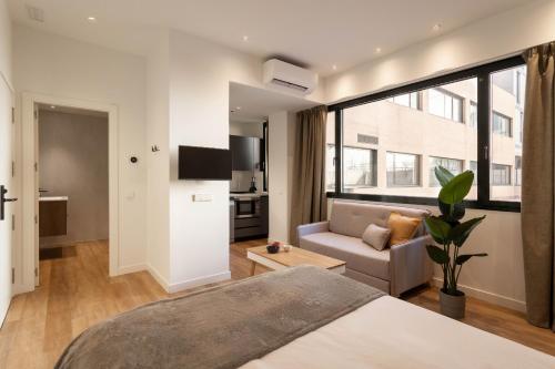 Postel nebo postele na pokoji v ubytování Catalina en Madrid