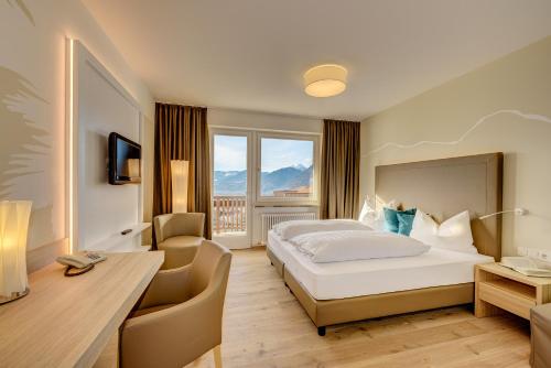 Postel nebo postele na pokoji v ubytování Garni Hotel Kessler