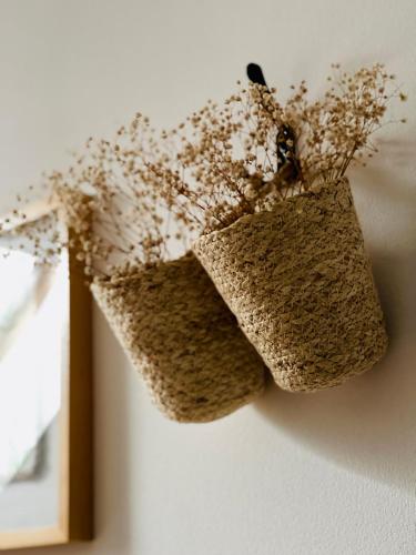 a pair of baskets hanging on a wall at Zagroda na Pacanach in Iwkowa