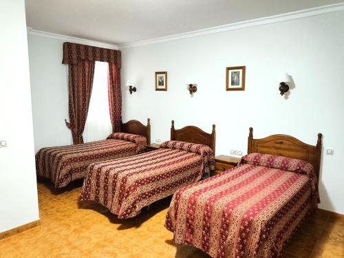Postel nebo postele na pokoji v ubytování Hostal Bellido