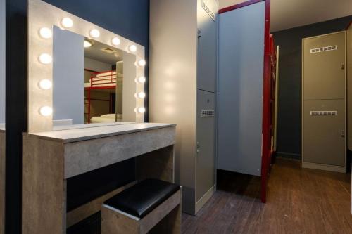 a dressing room with a mirror and a stool at Kabannas Liverpool in Liverpool