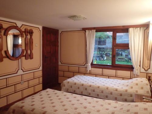 Ένα ή περισσότερα κρεβάτια σε δωμάτιο στο Nenchova Guest House