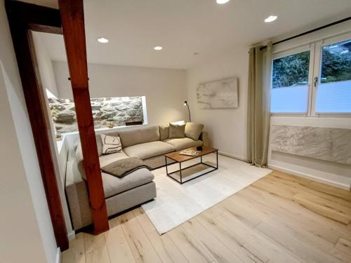 a living room with a couch and a table at Dein Eifelhaus in Langenfeld