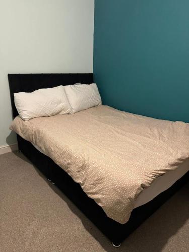 Ένα ή περισσότερα κρεβάτια σε δωμάτιο στο Cozy private room in South London