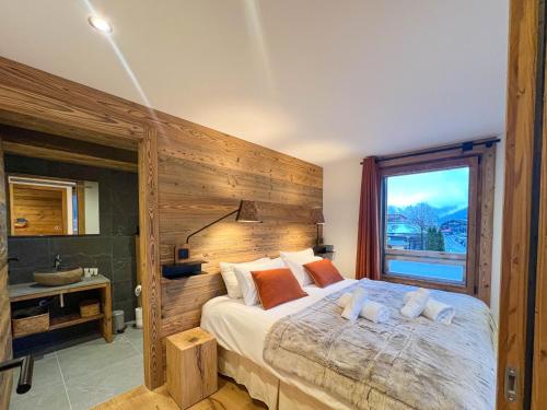 Postel nebo postele na pokoji v ubytování Appartement familial Les Gets - 3 ch, Wi-Fi, 8 pers, parking - FR-1-671-278