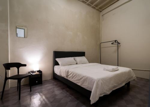 Postel nebo postele na pokoji v ubytování Aayu Pantai George Town Penang