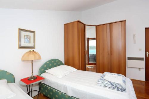 Postel nebo postele na pokoji v ubytování Apartment Sara
