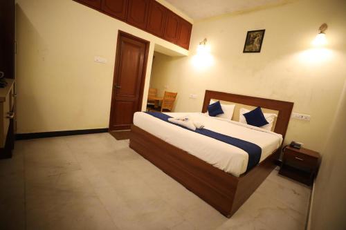 a bedroom with a large bed in a room at A.R Residency in Chennai