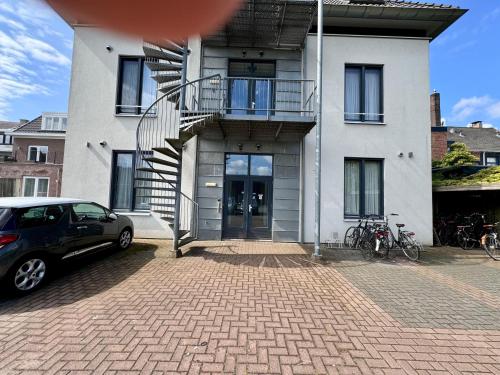 a house with a car parked in front of it at 86 1 City Appartement in Enschede