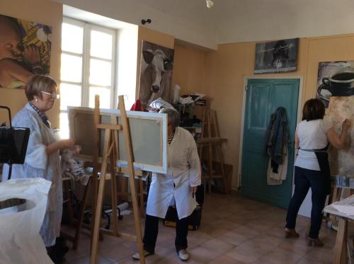 a group of people in a room with a painting at Domaine de la Manse in Villeneuve-de-Berg