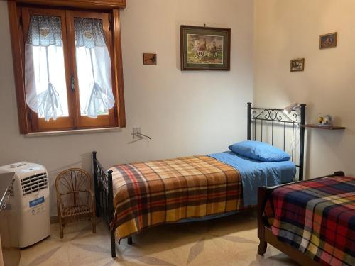 Postel nebo postele na pokoji v ubytování “da nonna Lucia”