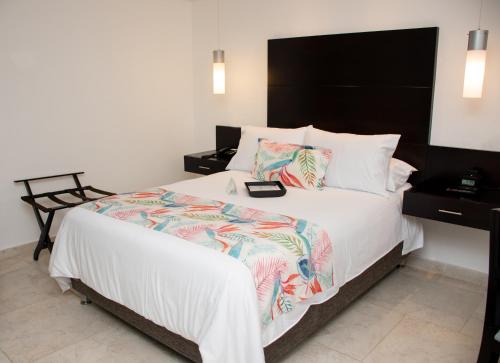 Postel nebo postele na pokoji v ubytování Hotel Capilla del Mar