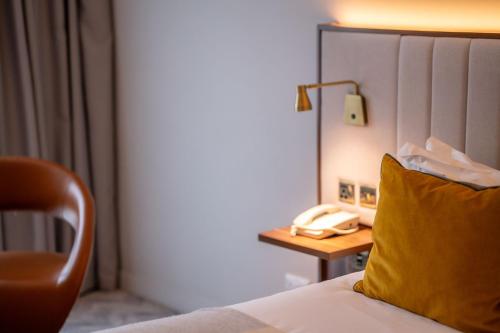 Кровать или кровати в номере The Address Citywest