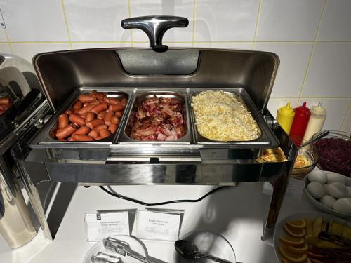 a tray of food on top of a stove at Campus Inspire Хмельницький in Khmelʼnytsʼkyy