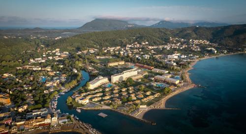 an aerial view of a town next to the water at Mitsis Messonghi in Moraitika