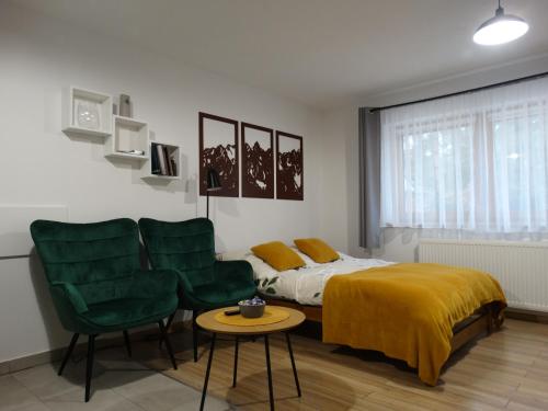 Posteľ alebo postele v izbe v ubytovaní Apartamenty Tatrzańska Dolina