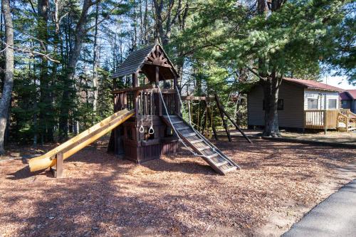 a playground with a slide in a yard at 2 bed condo on Duck Lake in Eagle River in Eagle River
