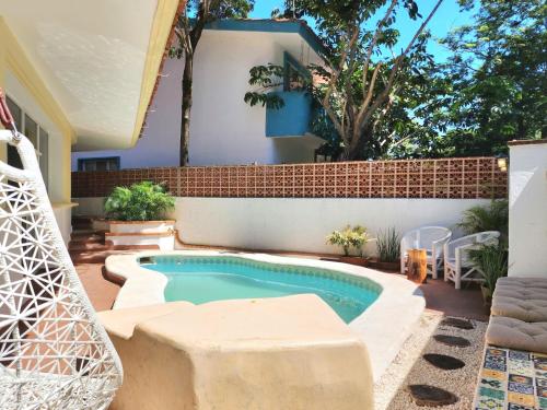 a swimming pool in the backyard of a house at Playacar Family house private pool and surrounded by nature in Playa del Carmen