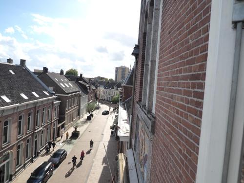 a view of a city street from a building at Hostel Roots in Tilburg