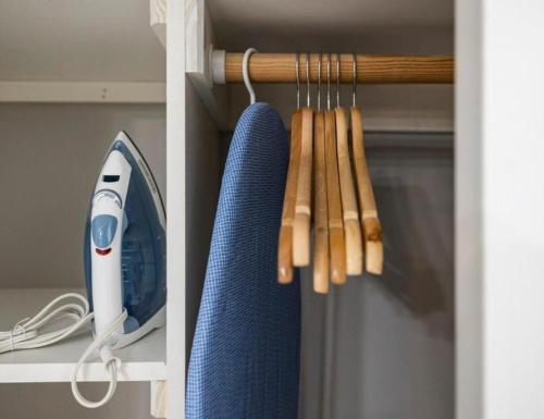 a shelf with a blue object and some wooden sticks at Upscale Studio in NY with Kitchen & Serene Setting in Congers