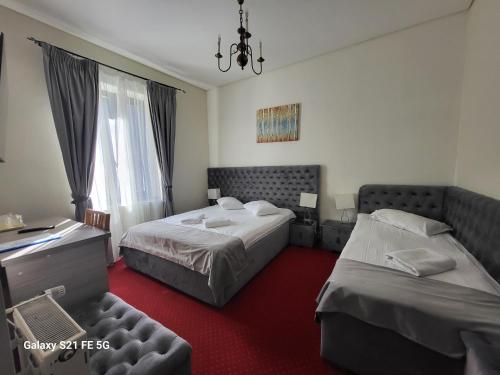 Postel nebo postele na pokoji v ubytování Hotel Stavilar