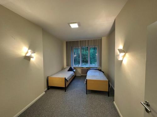 Postel nebo postele na pokoji v ubytování AMT Hotel Hamburg