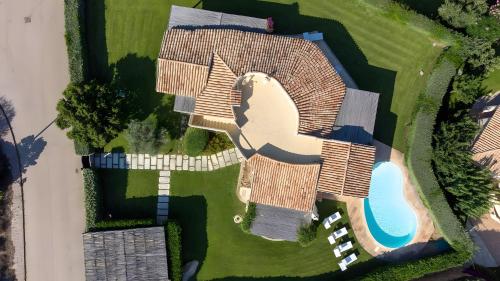 an overhead view of a house with a pool at Villa Maddalena in Porto Rafael