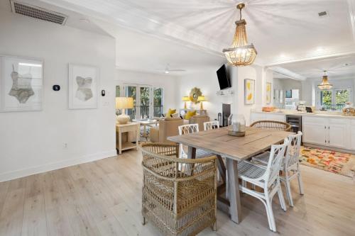 a kitchen and dining room with a table and chairs at Poolside at DeBordieu Colony in Georgetown