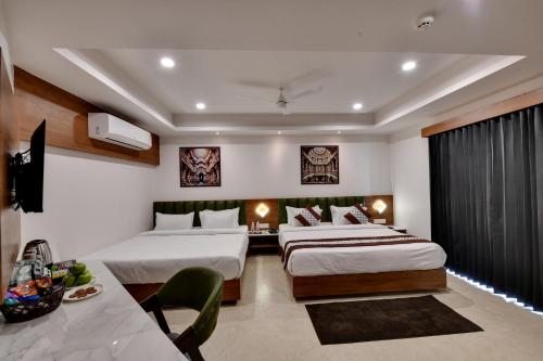 Ένα ή περισσότερα κρεβάτια σε δωμάτιο στο Soil to Soul Trinity Hotel - A Boutique Stay