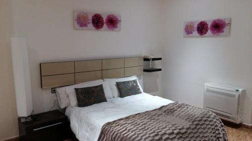 Postel nebo postele na pokoji v ubytování Hotel Oasis Familiar