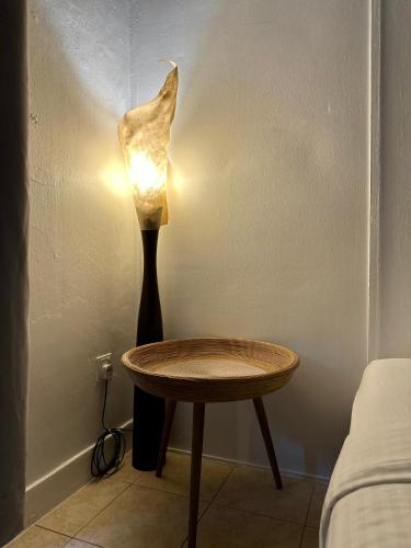 a lamp next to a table next to a bed at Ardour Lodge "B" Wing in George Town
