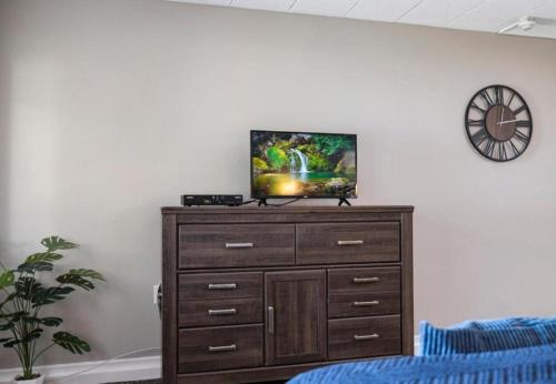 a tv on top of a dresser in a room at Upscale Studio in NY with Kitchen & Serene Setting in Congers