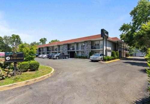a hotel with a parking lot in front of it at Upscale Studio in NY with Kitchen & Serene Setting in Congers