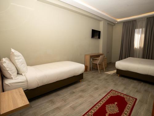 Postel nebo postele na pokoji v ubytování HOTEL CAFE PALAIS SALAM , Beni Mellal
