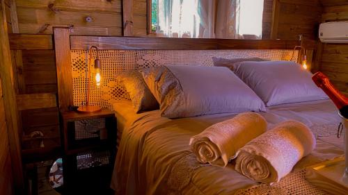 Cama o camas de una habitación en Chalé Morada dos Tucanos