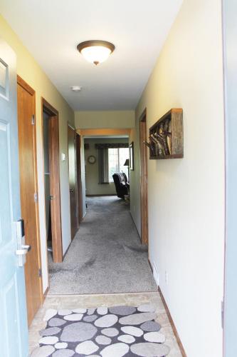 a hallway of a home with a hallway at 2 Bedroom Condo at Wild Eagle Lodge, #136 in Eagle River
