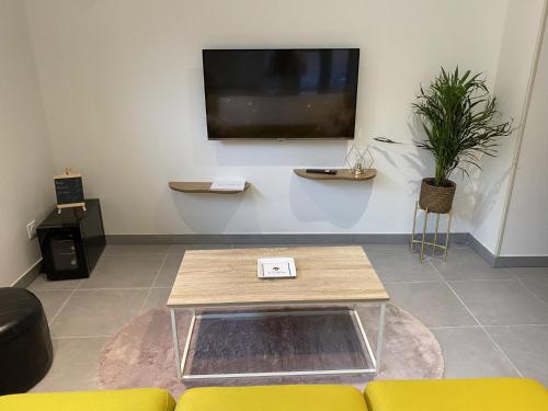 TV o dispositivi per l'intrattenimento presso Maison individuelle avec terrasse et parking