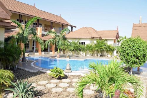 a swimming pool in front of a house at Paradise Estate in Katamanso