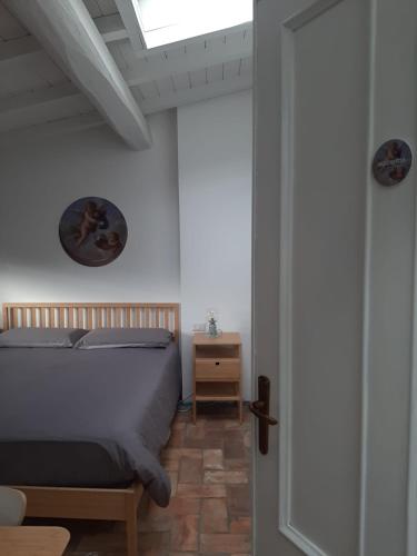 Ένα ή περισσότερα κρεβάτια σε δωμάτιο στο Agriturismo la Romanella