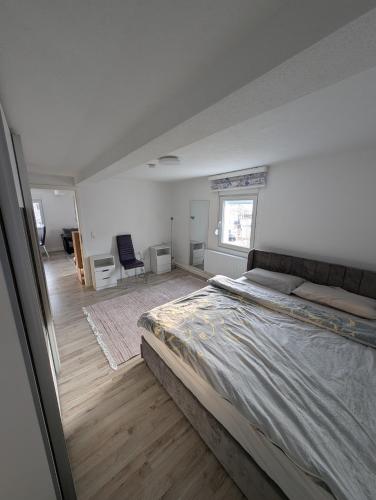 a bedroom with a large bed in a room at 2 Room apartment in Göppingen
