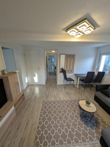 a living room with a couch and a table at 2 Room apartment in Göppingen