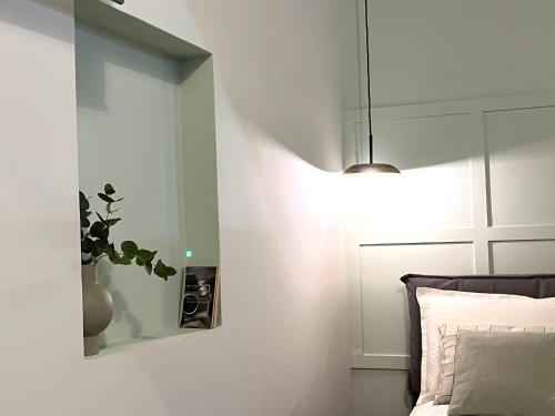 Ένα ή περισσότερα κρεβάτια σε δωμάτιο στο Insula - Apartments & Comfort in Ortigia