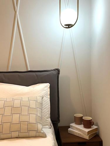 Ένα ή περισσότερα κρεβάτια σε δωμάτιο στο Insula - Apartments & Comfort in Ortigia