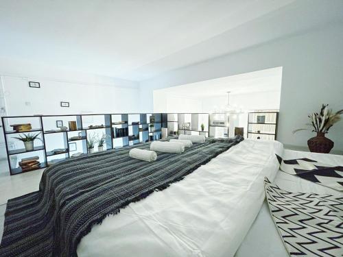 a bedroom with a large bed with pillows on it at Old Town Loft in Bucharest