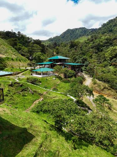 an aerial view of a house on a hill at Hotel Rivel - Restaurant & Nature Retreat in Turrialba