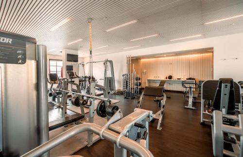 a gym with treadmills and machines in a room at Hotel Fasano Sao Paulo in Sao Paulo