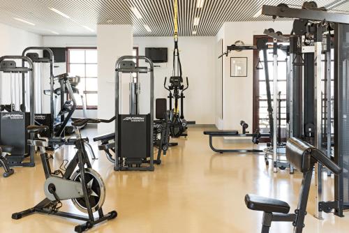 a gym with several treadmills and exercise bikes at Hotel Fasano Sao Paulo in Sao Paulo